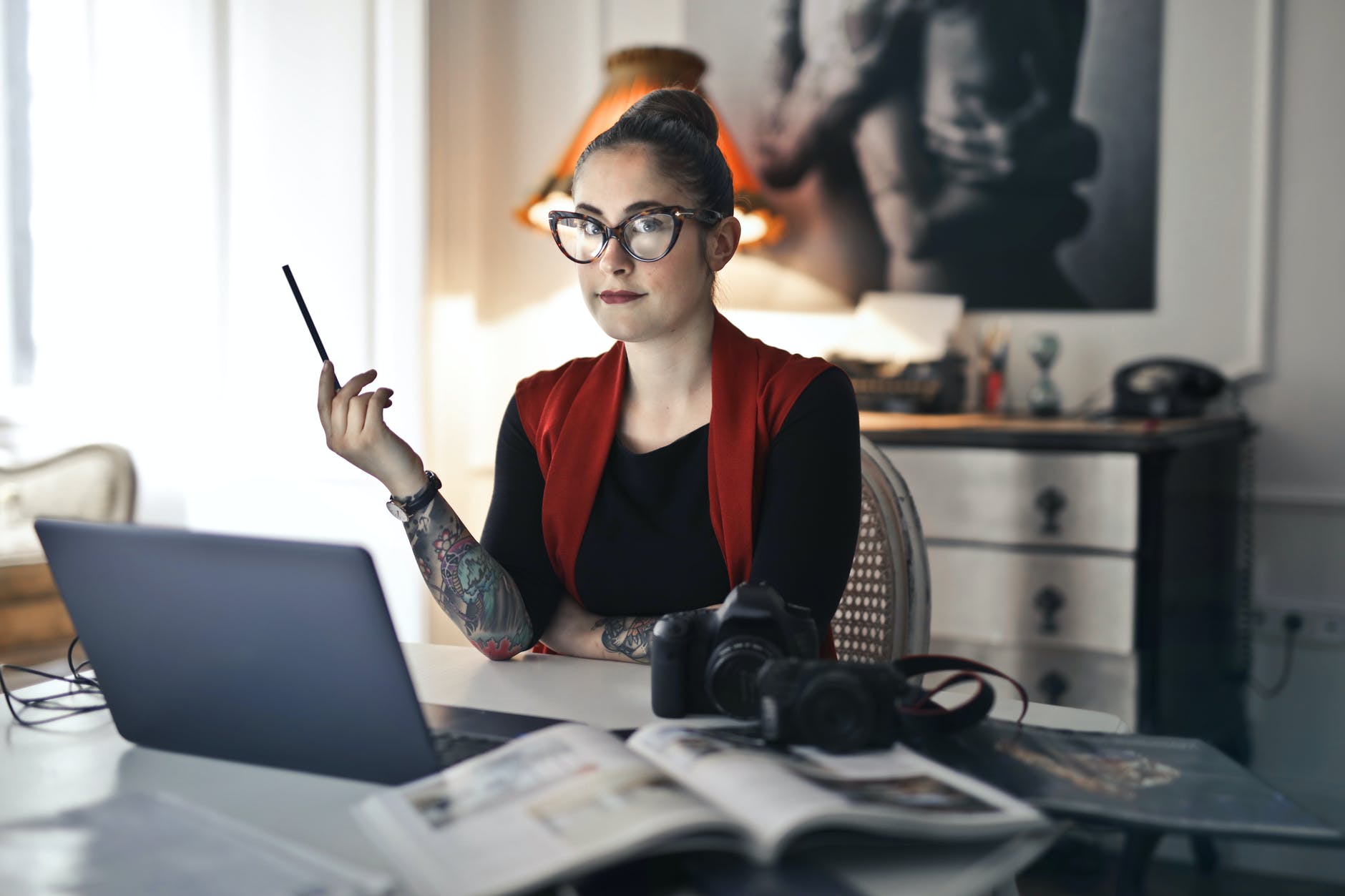 informal adult woman using laptop for working with photo project